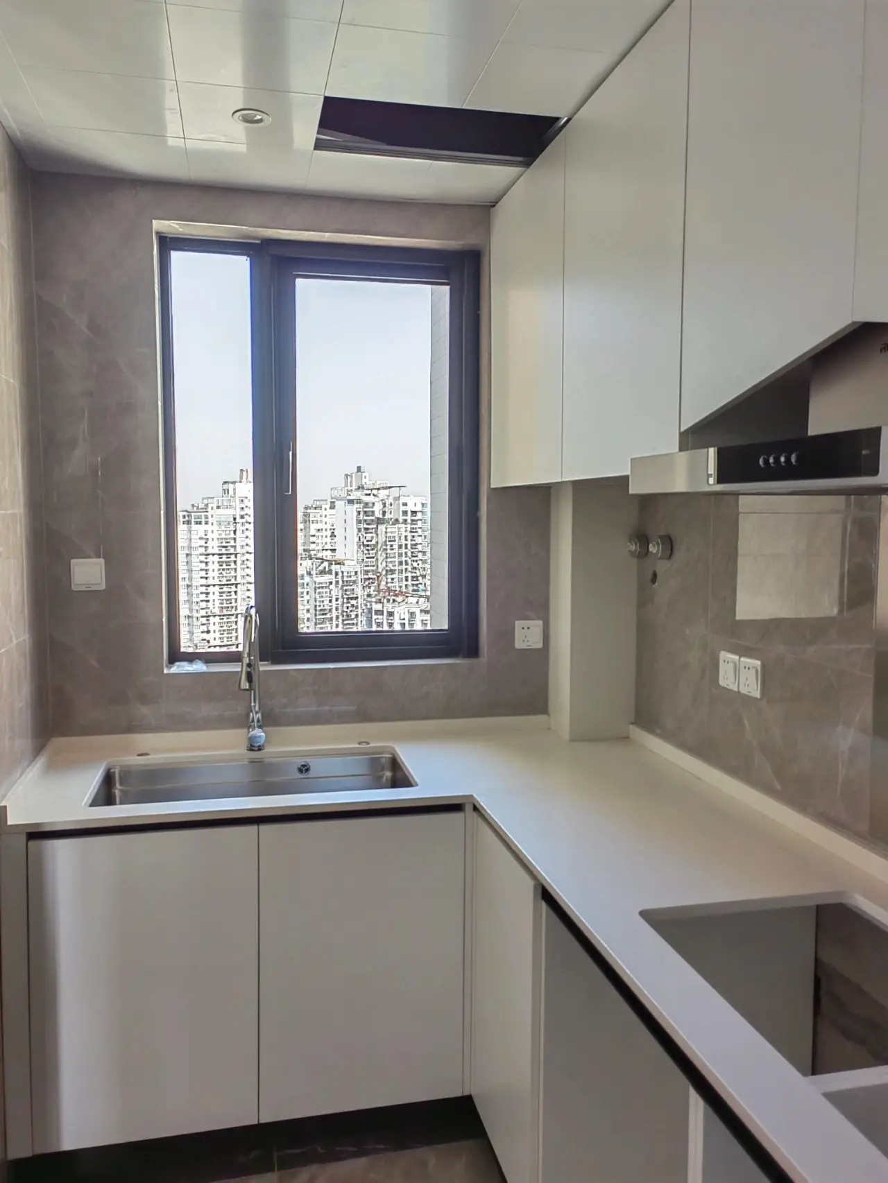Compact White Kitchen with City View