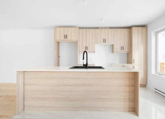 Natural Wood Tone Kitchen with Waterfall Island