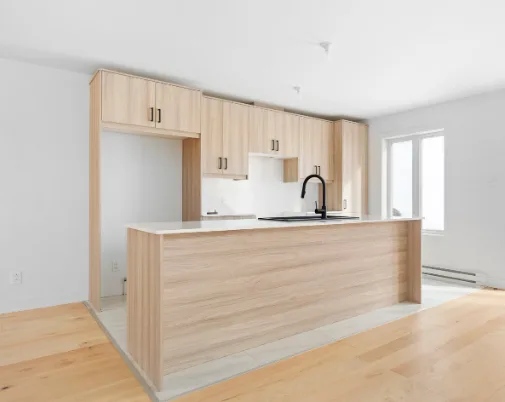 Open Concept Natural Wood Kitchen with Black Fixtures